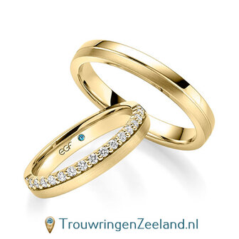 Trouwringen in 14/18 karaat geelgoud mat en glans met een kroonzetting van 17 diamanten - halve ring - in de damesring