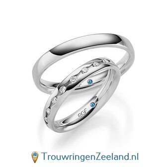 Trouwringen in 14/18 karaat witgoud glans met in de damesring 19 diamanten geheel rondom waarbij elke diamant als een oog is gezet.