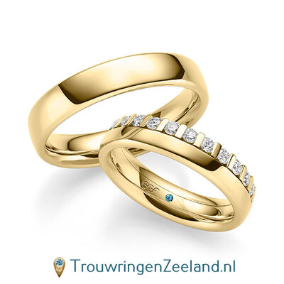 Trouwringen in 14/18 karaat geelgoud glans met een kroonzetting van 12 diamanten - halve ring -  in de damesring