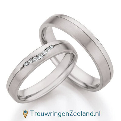 Trouwringen in palladium 500/950 met 7 diamanten in een V-vorm