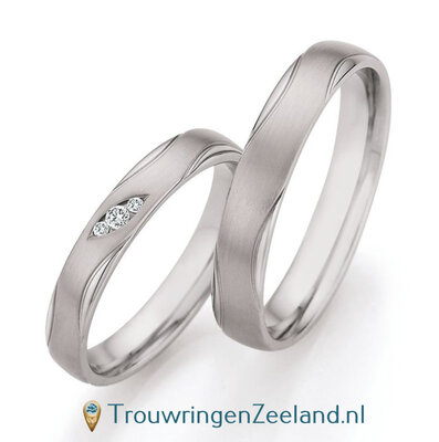 Trouwringen in palladium 500/950 golvend met 3 diamanten in een ovaal geplaatst